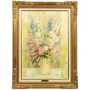 Soft pastel floral still life of a bouquet in a vase with pale yellow and pink blossoms in a gilded frame.