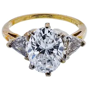 14k yellow gold ring with GIA-certified 4.00 carat E VS2 round brilliant diamond and tapered side stones.