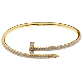 Cartier 18k yellow gold bracelet with pavé diamond nail motif design.