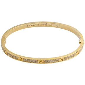 Cartier 18k yellow gold Love bracelet with diamond-set screw motifs.