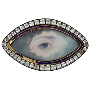 Georgian lover’s eye brooch with hand-painted eye miniature surrounded by diamonds and enamel border.