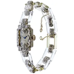 Cartier vintage bracelet watch with rock crystal links and diamond-set case.